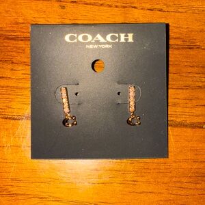 Rose gold Coach earrings